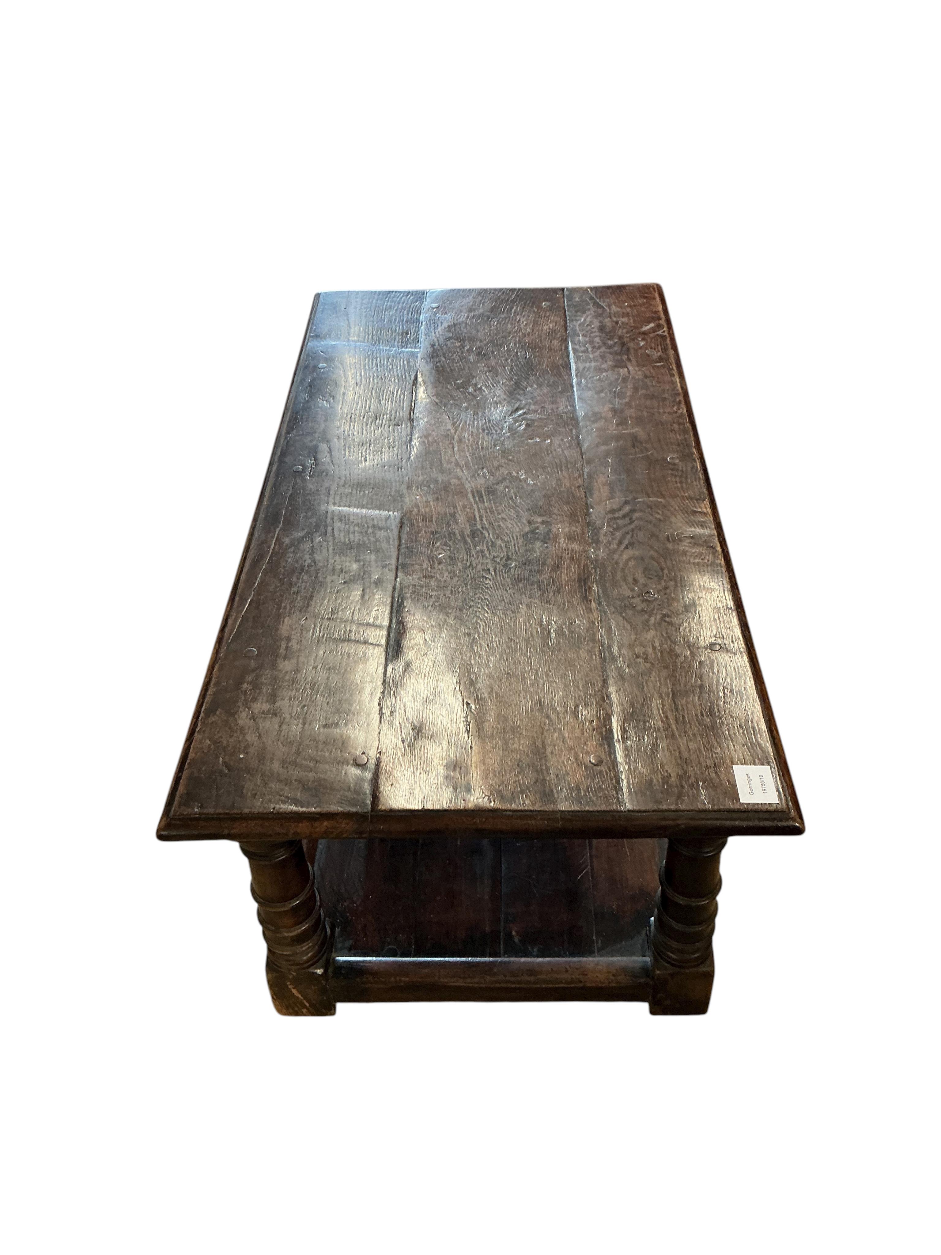 A 17th century style rectangular oak two tier coffee table, width 106c, depth 55cm, height 43cm